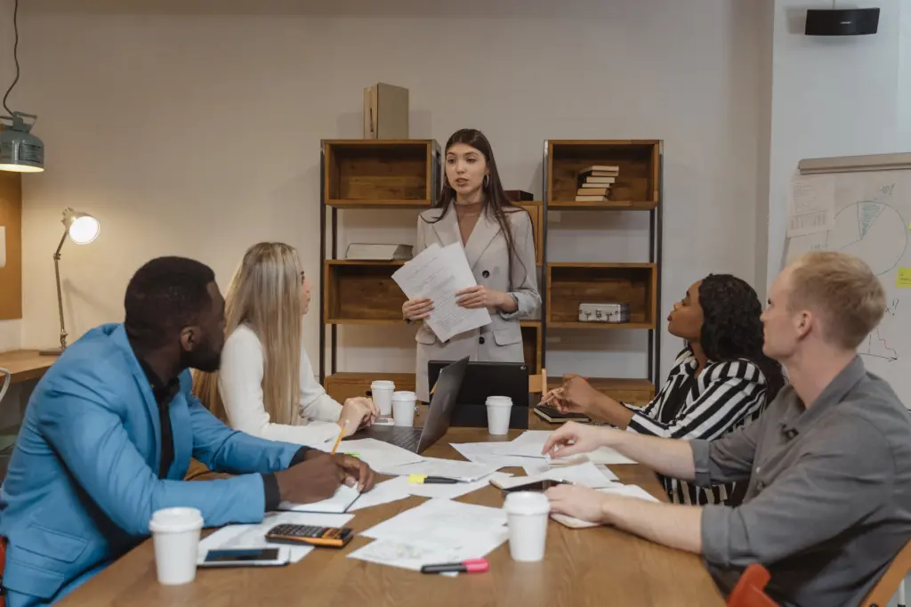 a group of people in a meeting room